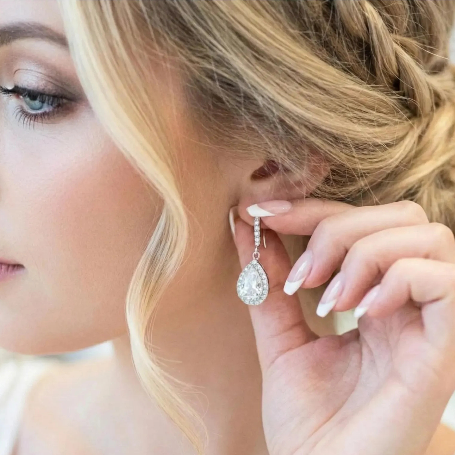 Close-up of a woman wearing a sparkling earring with a blurred background
