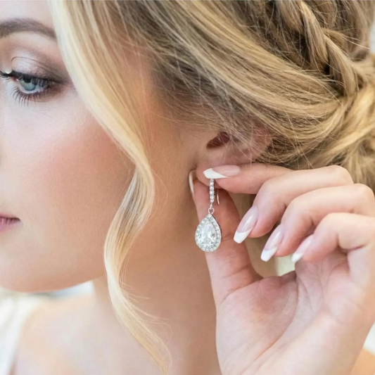 Close-up of a woman wearing a sparkling earring with a blurred background