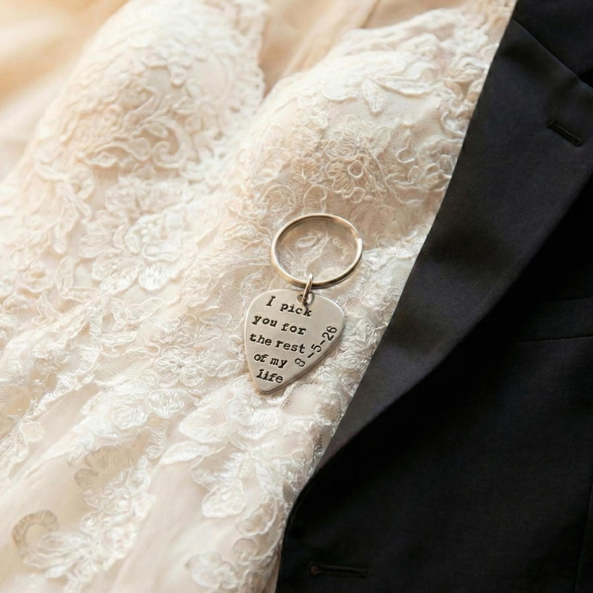 Personalized guitar pick keychain with engraved text I pick you for the rest of my life on a wedding dress and tuxedo.