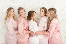 Bride and bridal party wearing crystal and pearl earrings