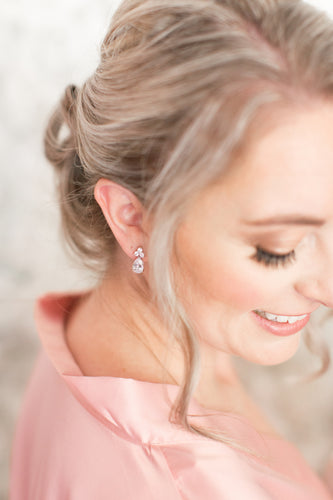 Bridesmaid wearing crystal stud earrings