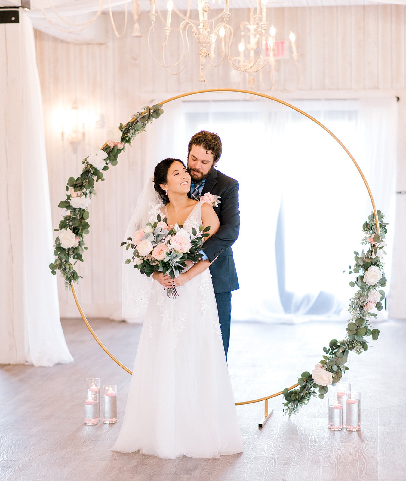 Bride and groom embracing at wedding reception