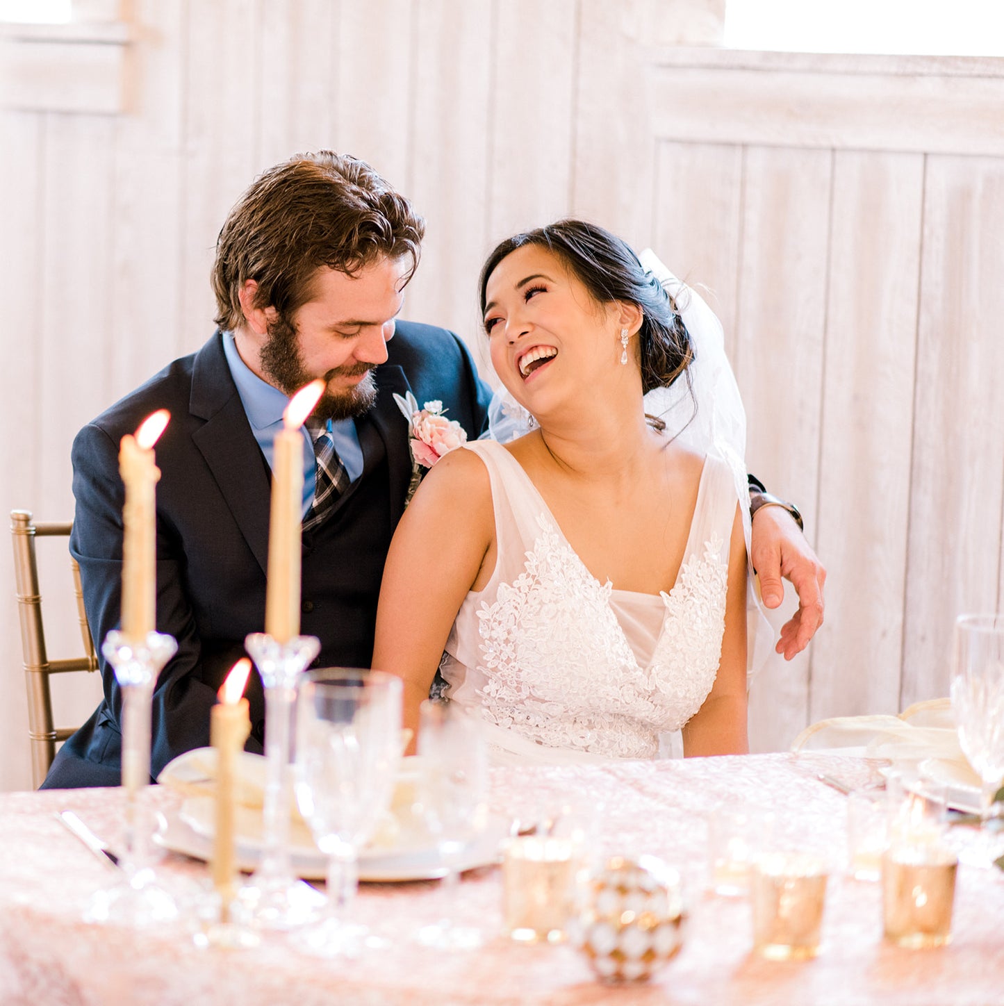 Bride wearing long crystal earrings 