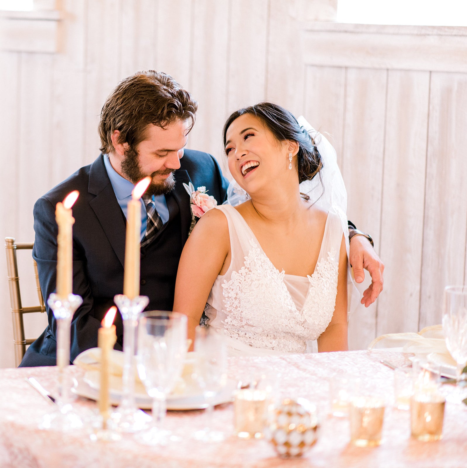 Bride wearing long crystal earrings 
