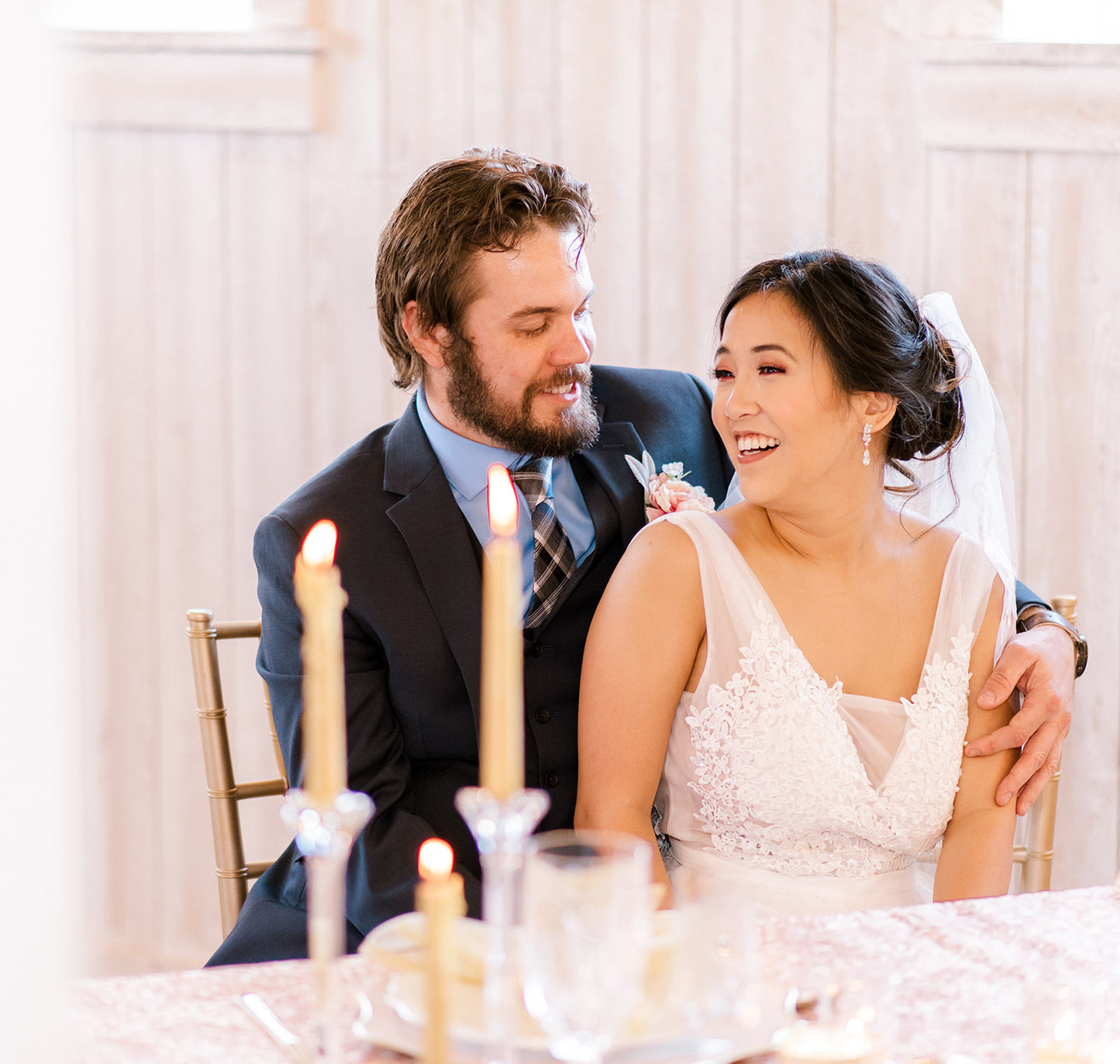 Bride wearing long earrings at wedding reception
