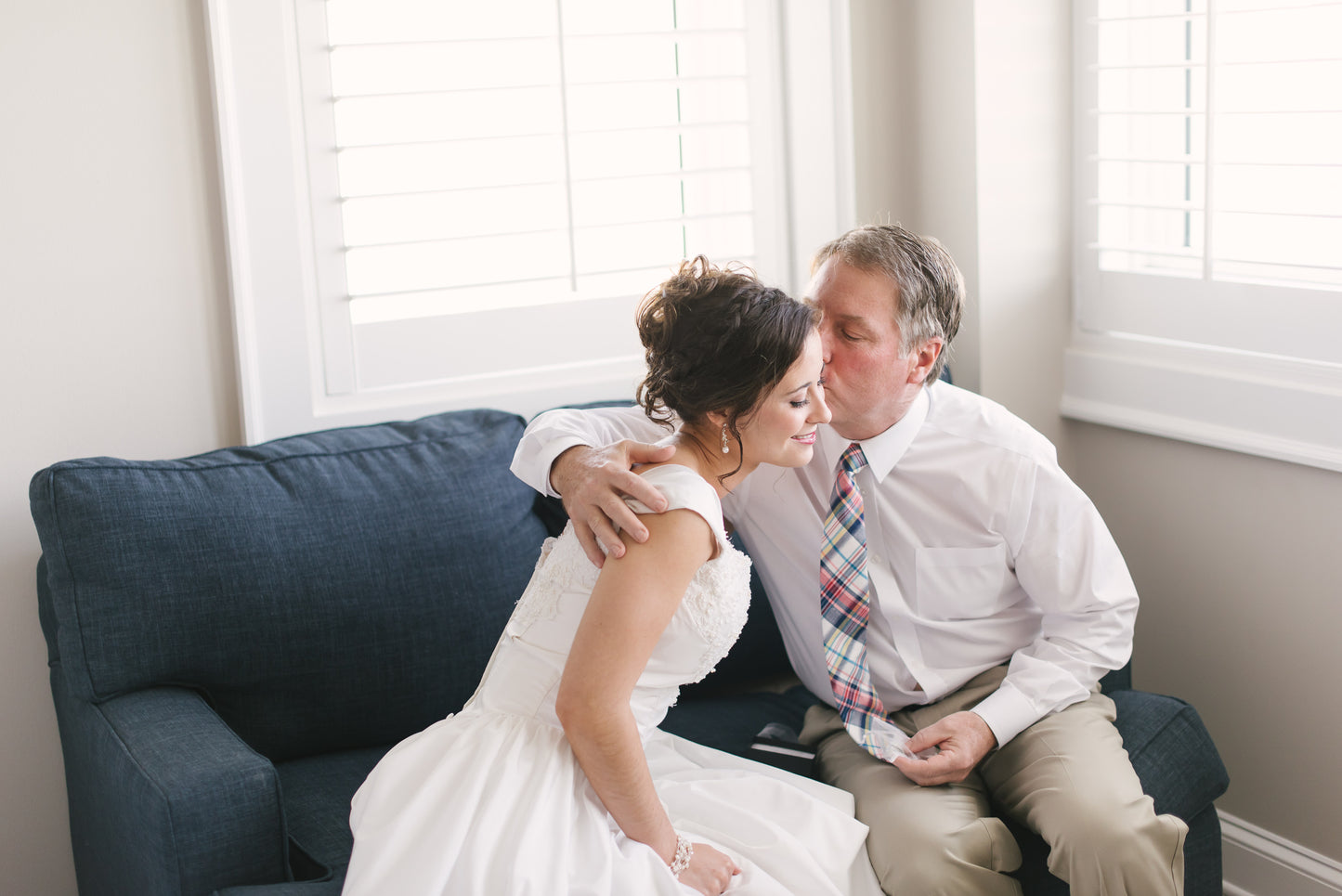 bride hugging dad after giving him always little girl gift