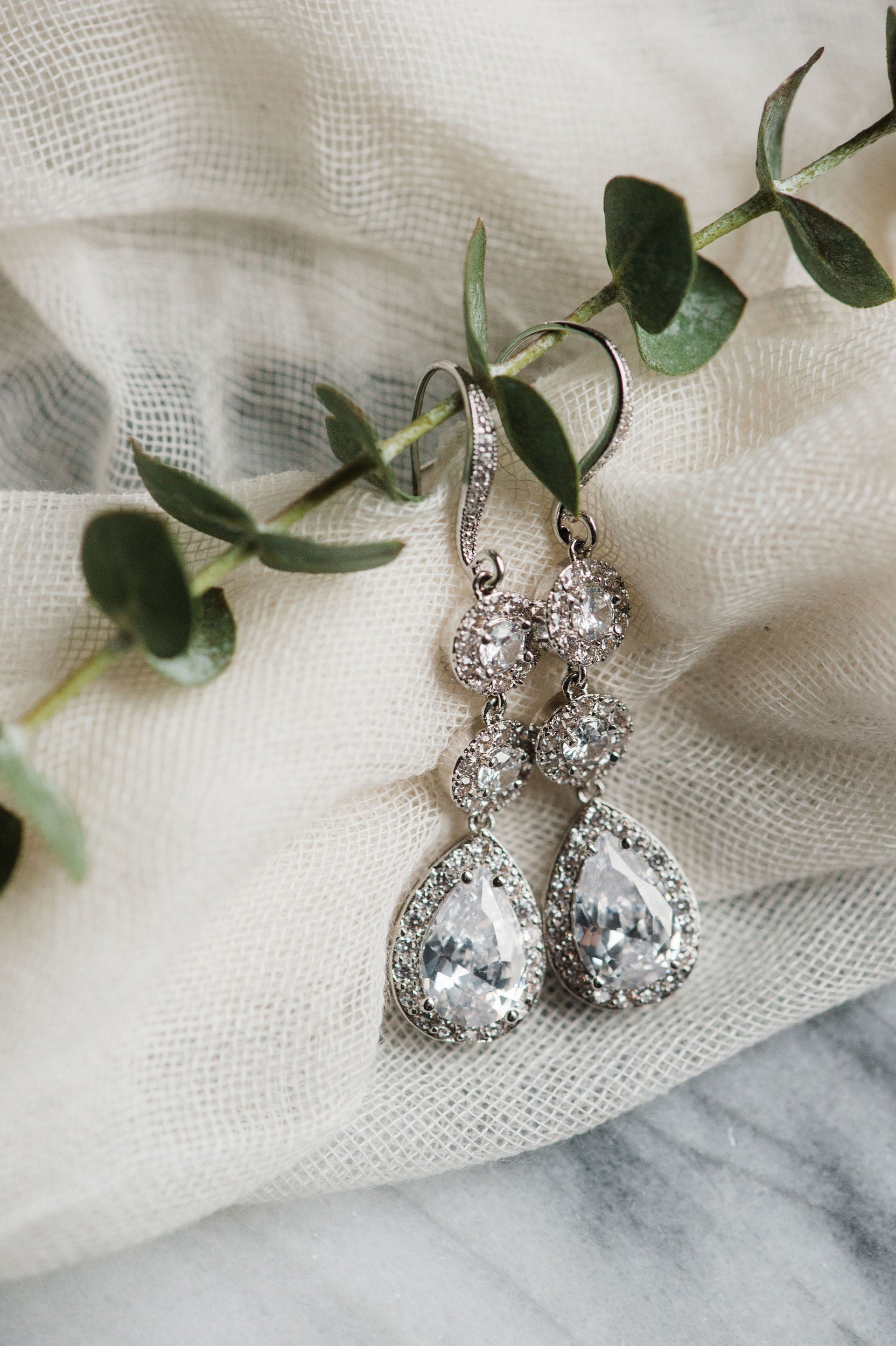 Long cubic zirconia earrings on display