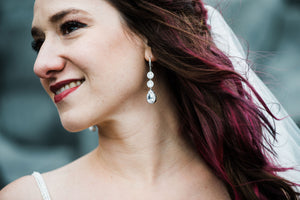Bride wearing long cz bridal earrings
