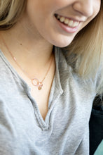 girl wearing rose gold eternity necklace