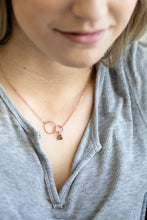 girl wearing rose gold necklace