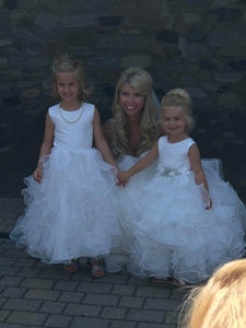 Bride with 2 flower girls wearing necklaces