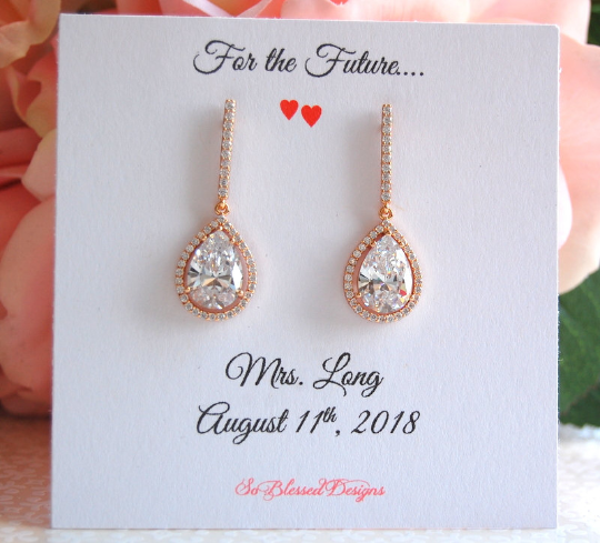 Rose gold teardrop earrings displayed on future Mrs jewelry card