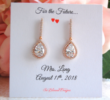 Rose gold teardrop earrings displayed on future Mrs jewelry card