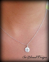 Model wearing sterling silver compass necklace