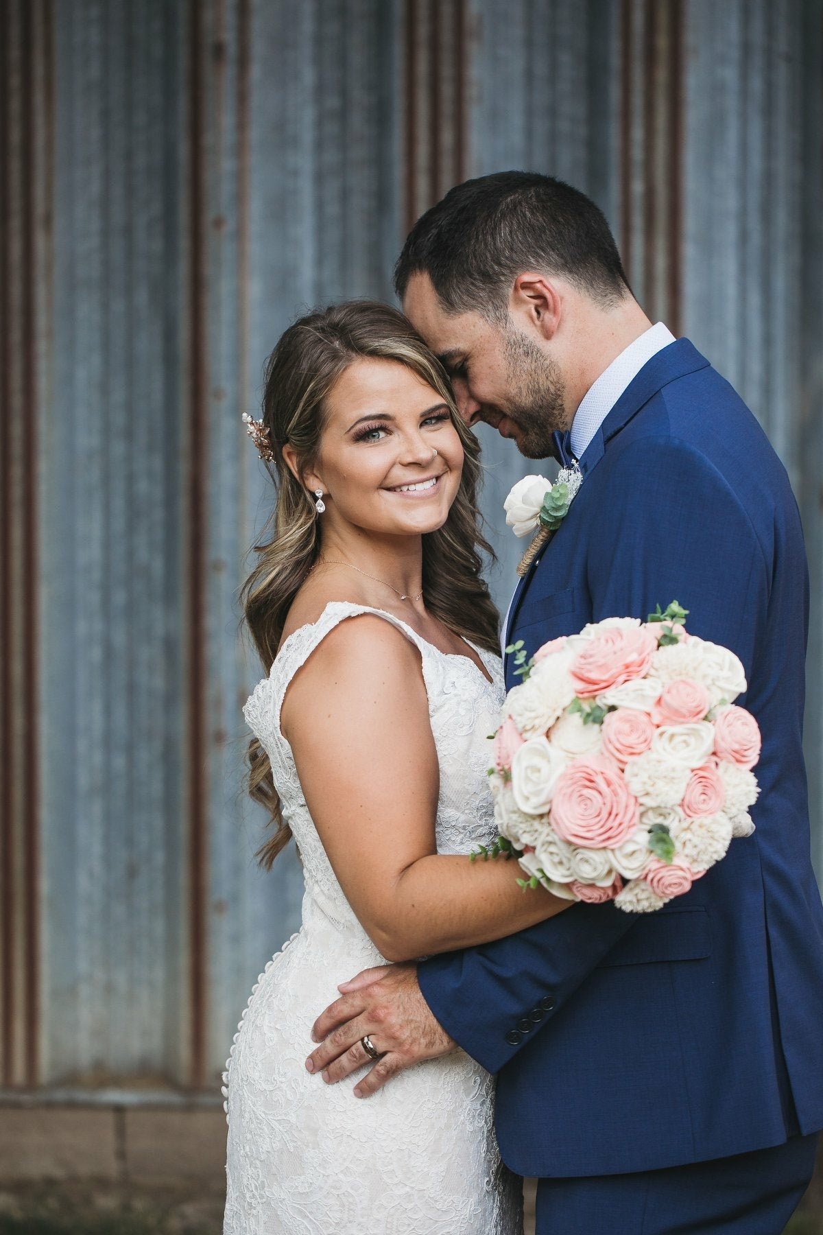 Bride and Groom holding each other after wedding ceremony