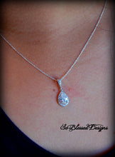 Mother of the Bride proudly wearing silver teardrop necklace