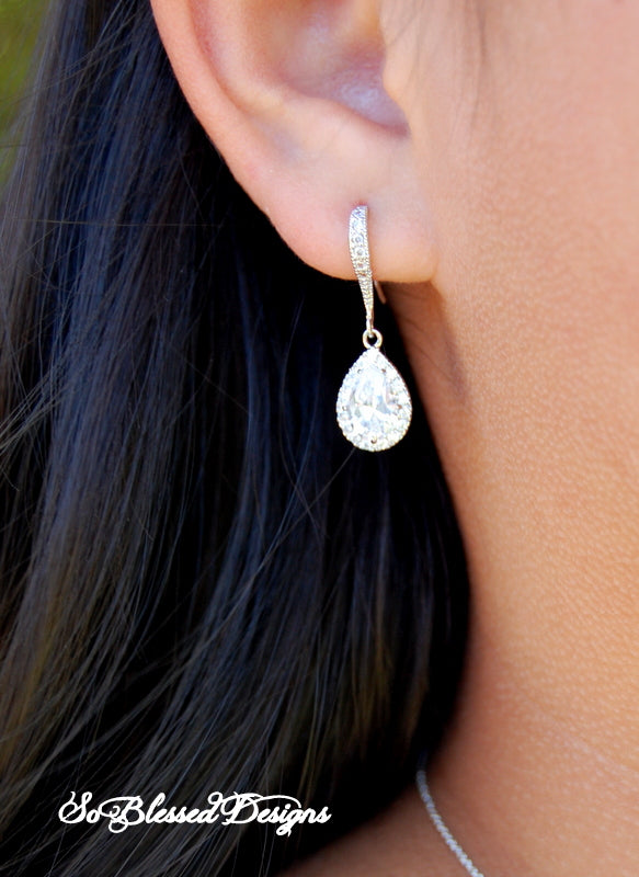 Mother of the Groom with silver teardrop earrings on for sons wedding