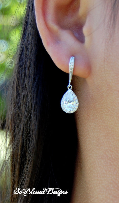 Mother of the groom wearing silver earrings on sons wedding day
