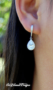 Bridesmaid wearing silver cubic zirconia earrings