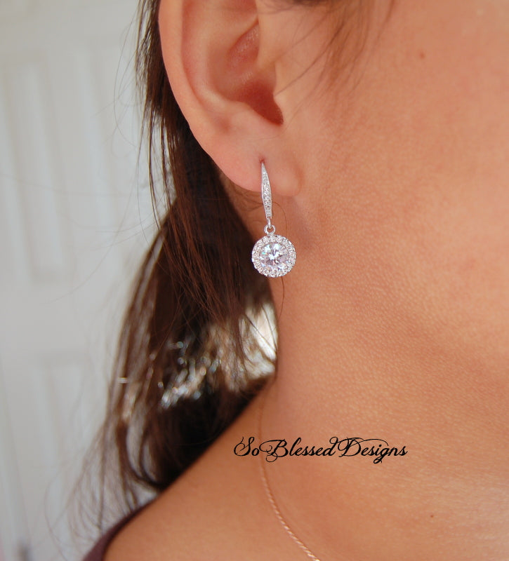 model wearing round cubic zirconia earrings