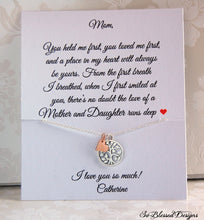 Sterling silver and rose gold family tree necklace displayed on jewelry message card