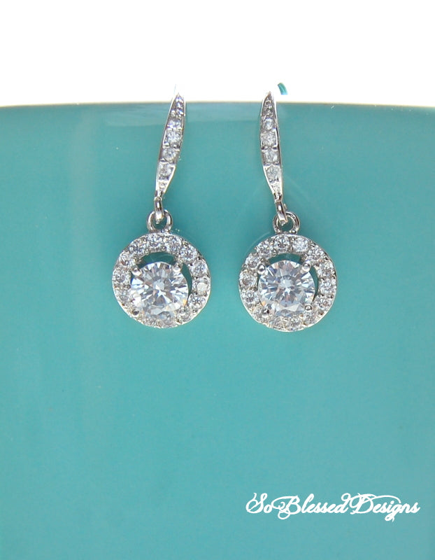 Pair of silver round solitaire earrings 
