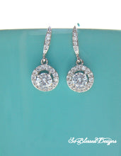 Pair of silver round solitaire earrings 