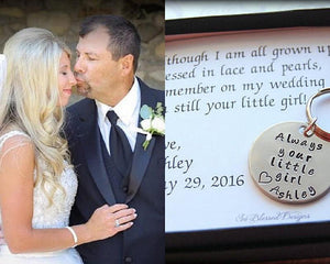 Dad kissing daugther on nose after giving him always your little girl keychain