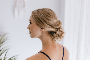 bridesmaid wearing long victorian earrings for wedding
