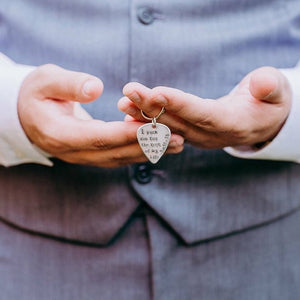 Groom holding I pick you keychain from his bride