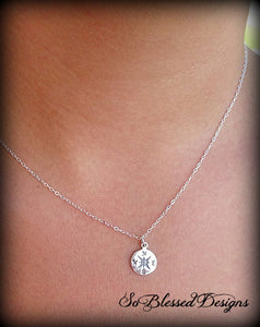 bridesmaid wearing silver compass pendant necklace