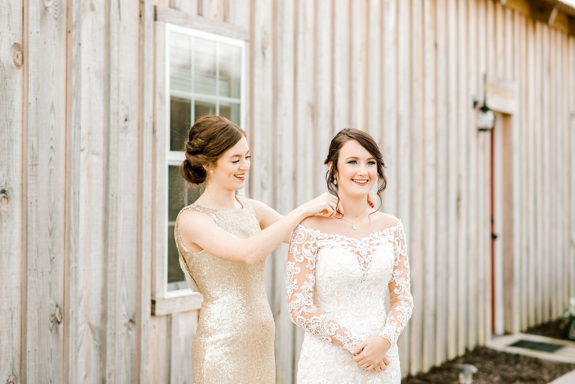 Bride wearing cubic zirconia earrings on wedding day