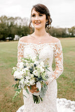 gorgeous bride wearing silver teardrop earrings