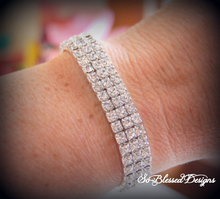 mother of the bride wearing cz bracelet from bride