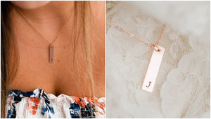 bridesmaid wearing rose gold initial necklace