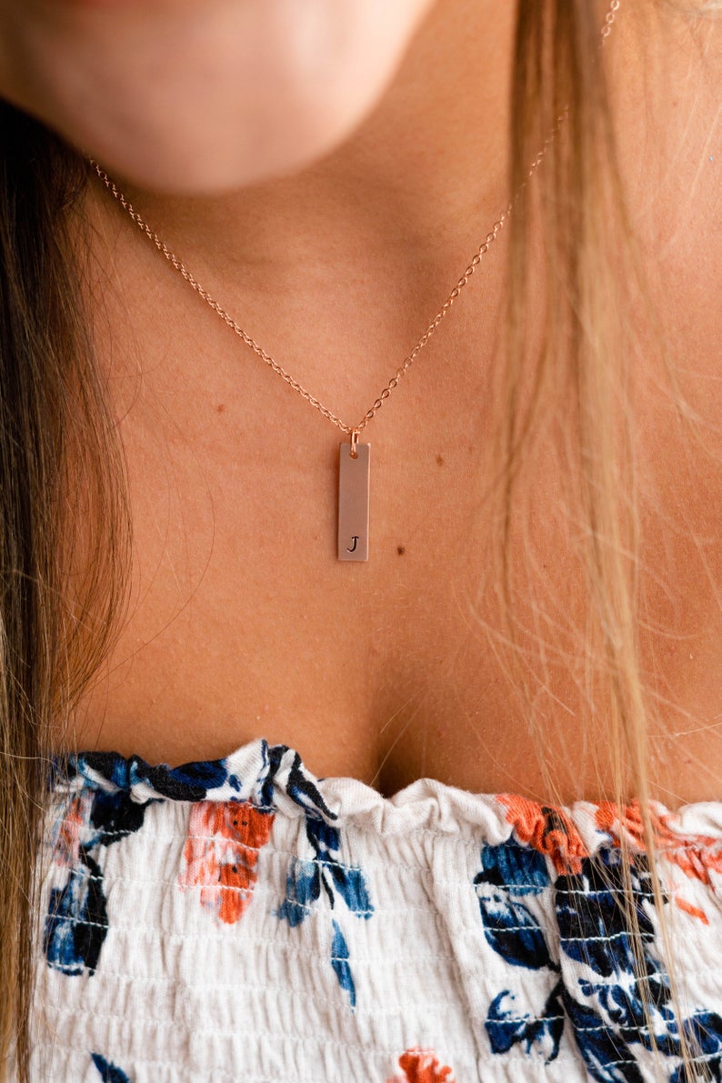 bridal party wearing initial rose gold necklaces