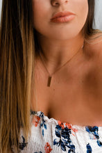 Rose gold tag necklace on model