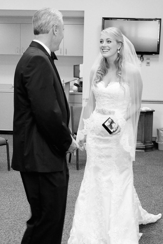 Bride giving Dad Always your little girl keychain on her wedding day