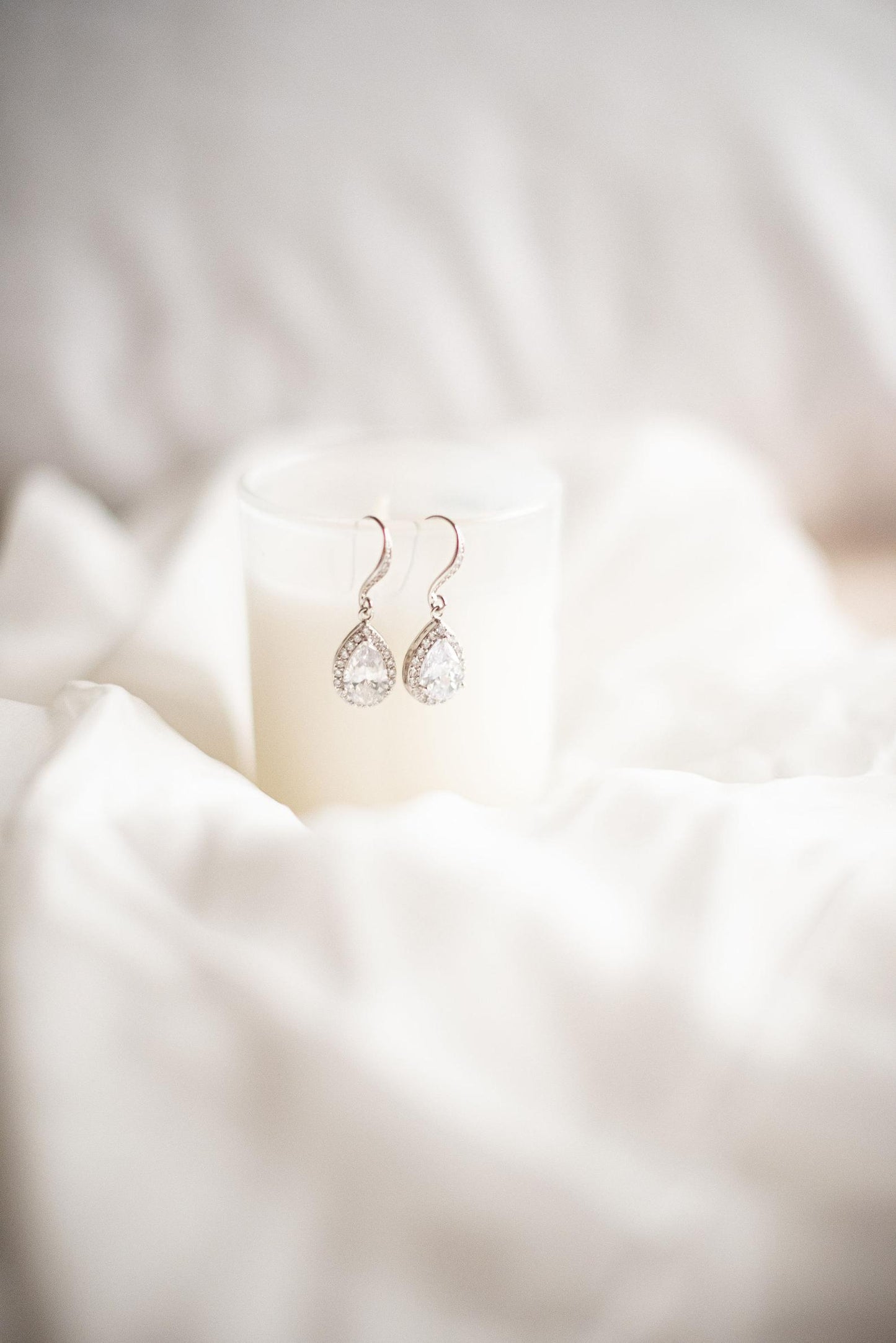Silver and cubic zirconia bridal earrings on display