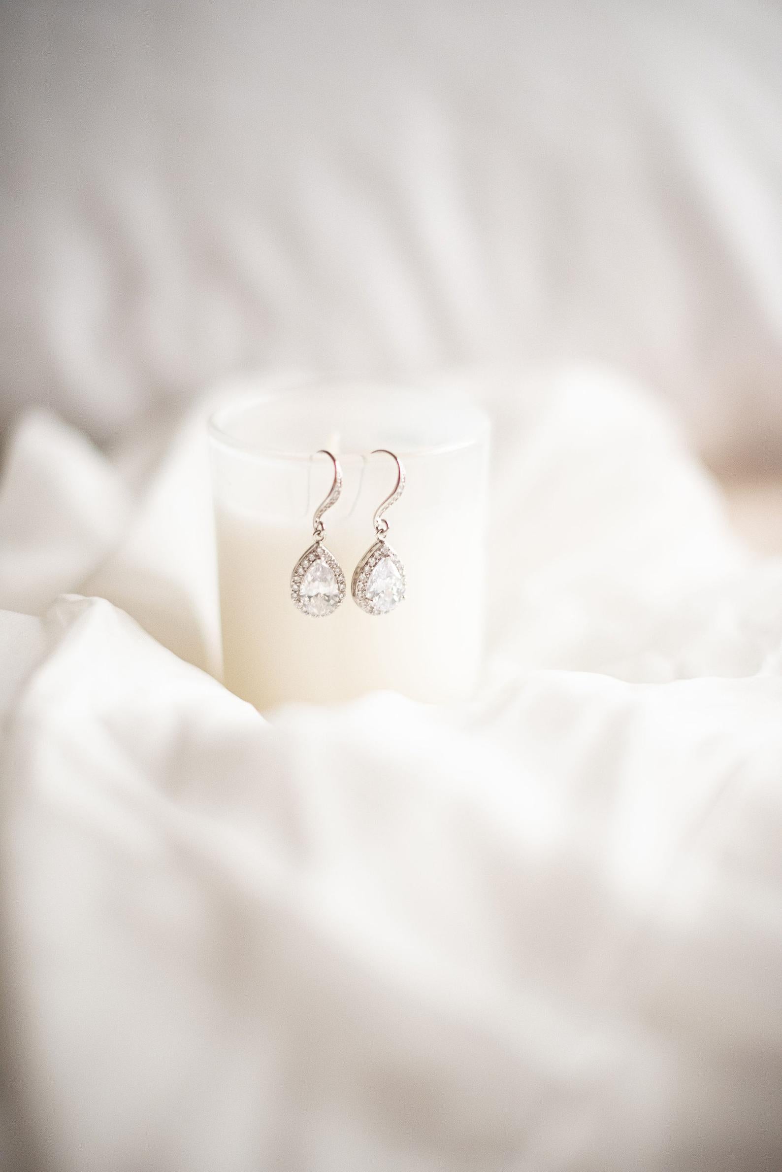 Silver and cubic zirconia bridal earrings on display