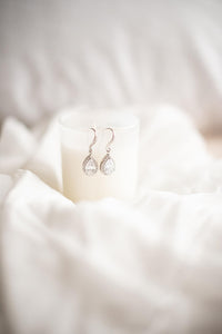 Silver and cubic zirconia bridal earrings on display