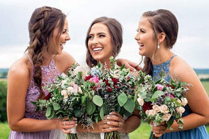Bride and bridesmaids wearing matching teardrop earrings for wedding