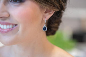 bridesmaid wearing navy blue earrings