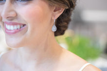 Bride wearing silver teardrop earrings