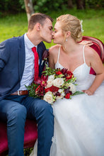 Groom kissing bride on wedding day 