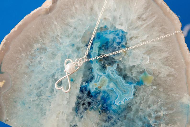 Gorgeous silver and pearl heart infinity necklace 