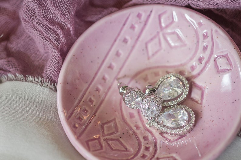 Silver crystal earrings on display 
