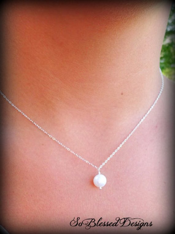 flower girl wearing pearl drop necklace for wedding