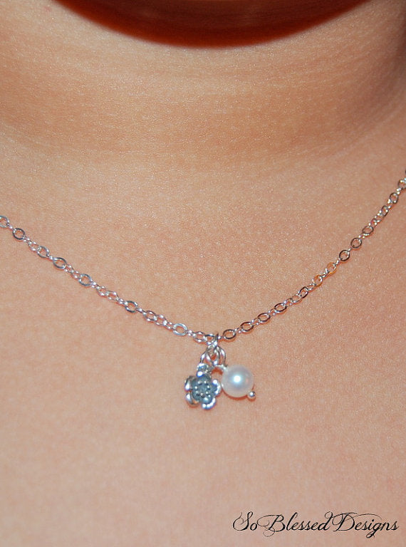 flower girl wearing silver and pearl necklace