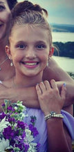 junior bridesmaid wearing teardrop earrings